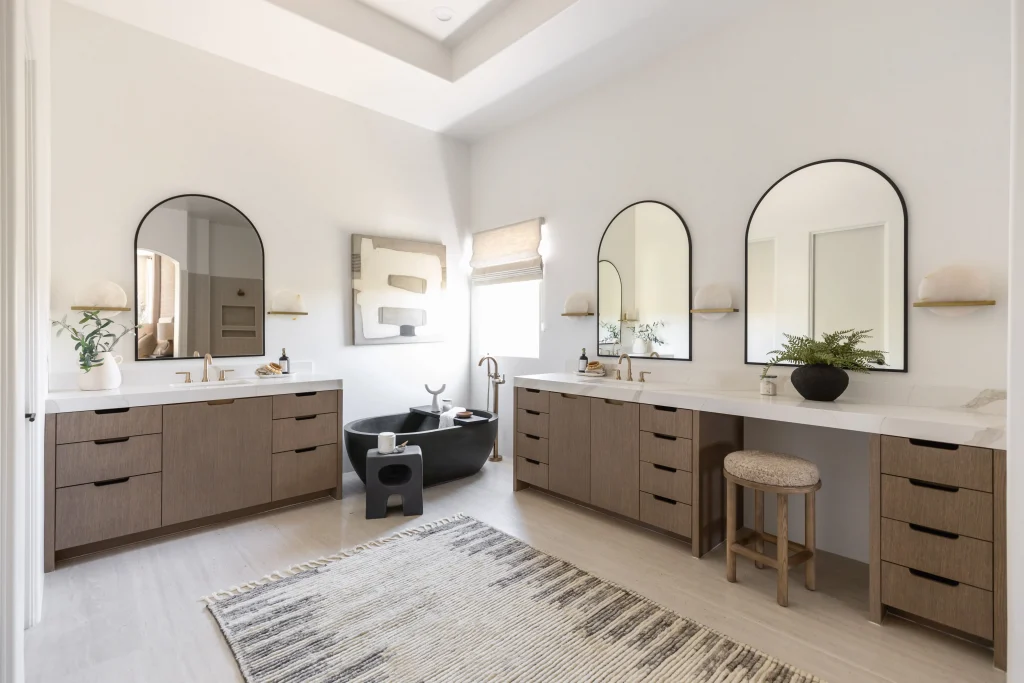 Bright bathroom with dual mirrors and sleek countertops