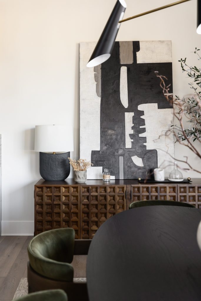 Close-up of wooden sideboard with abstract art