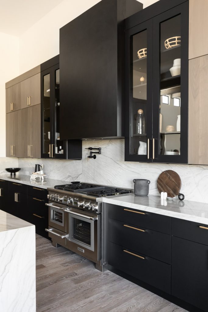 Kitchen with black and wood cabinetry