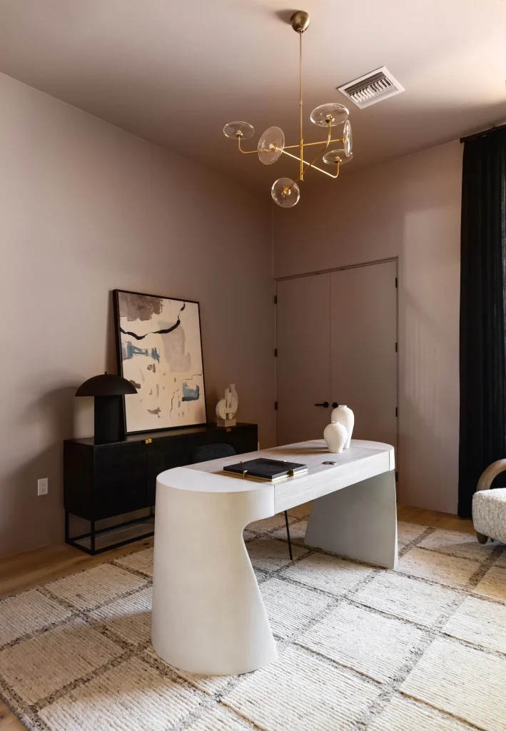 Contemporary home office with minimalist desk and decor