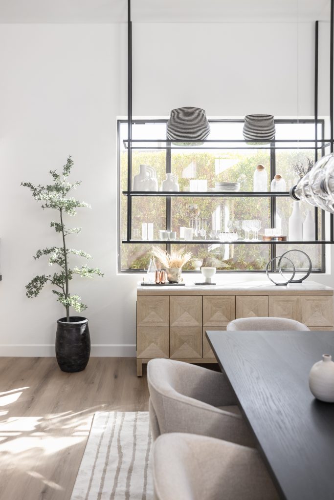 Bright dining area with natural light and plants