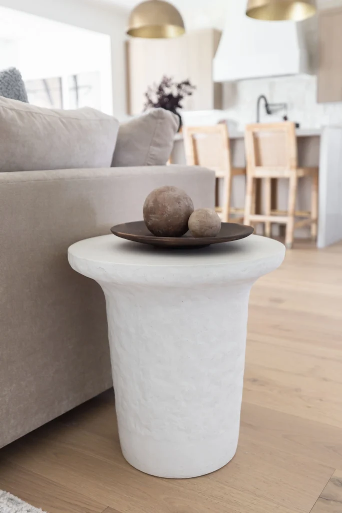 White side table with decorative spheres