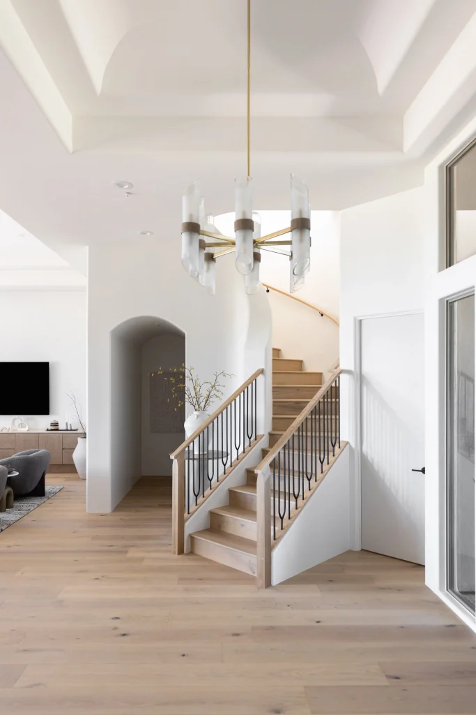 Open space with modern staircase and pendant lighting