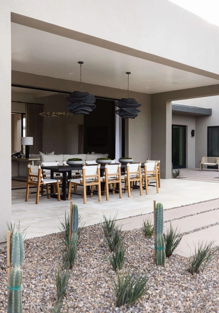 Modern outdoor dining space with desert plants