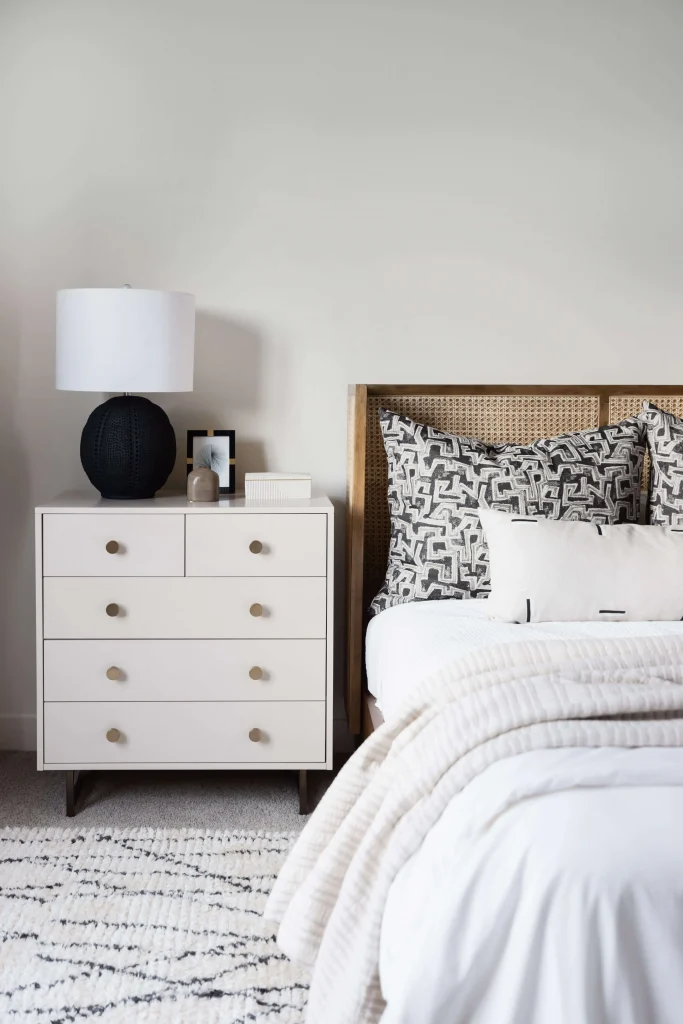 Cozy neutral bedroom with patterned pillows