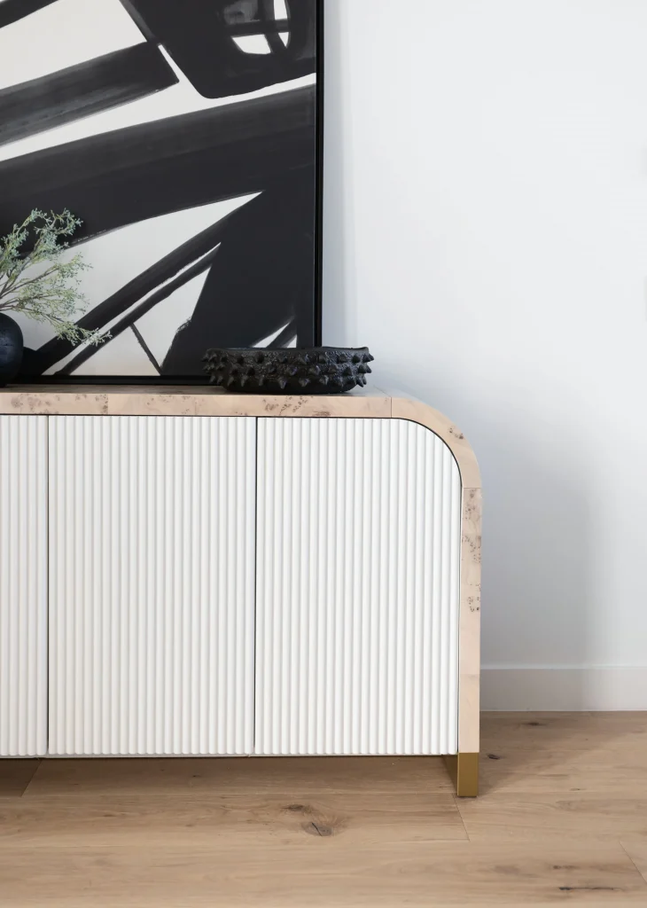 Close-up of white fluted sideboard