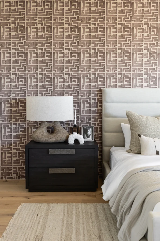 Modern bedroom with textured wall and wooden nightstands