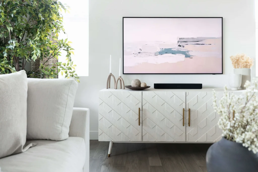 Bright living room with abstract art and plants