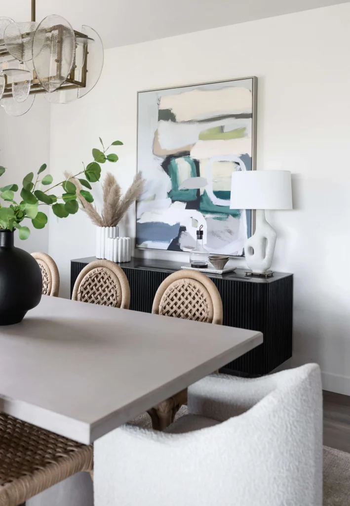 Dining room with abstract art and plants