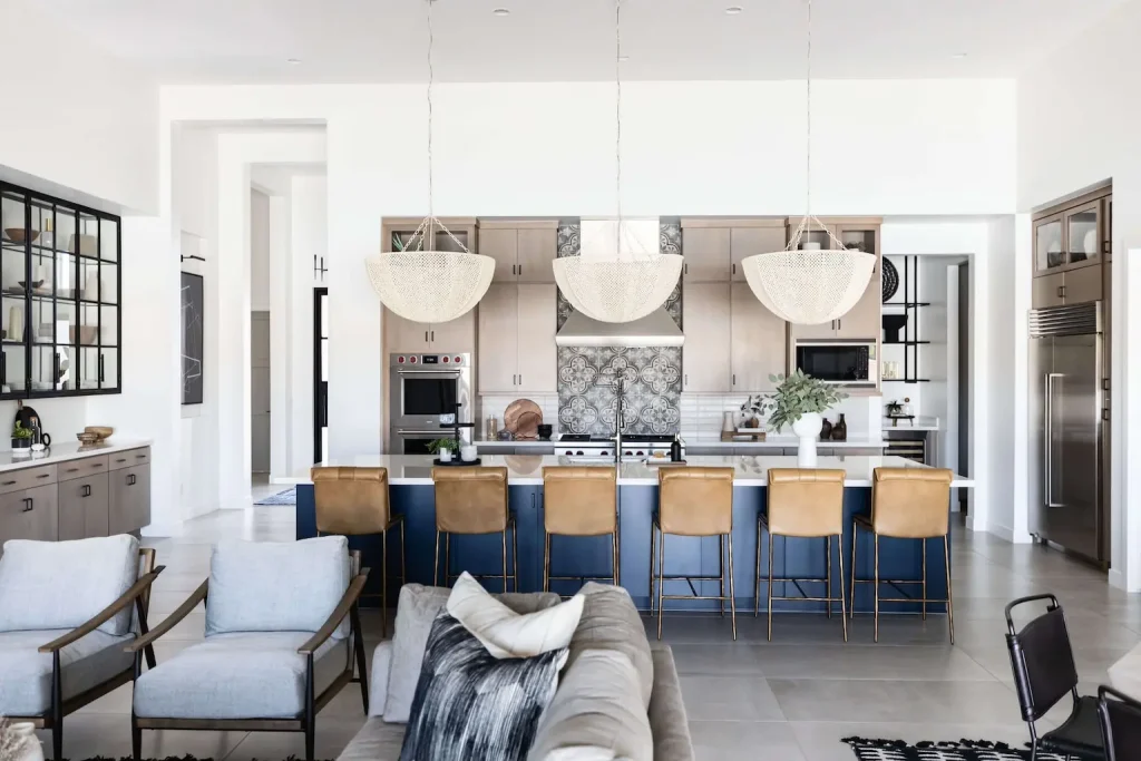 Open-concept kitchen and living space with navy island