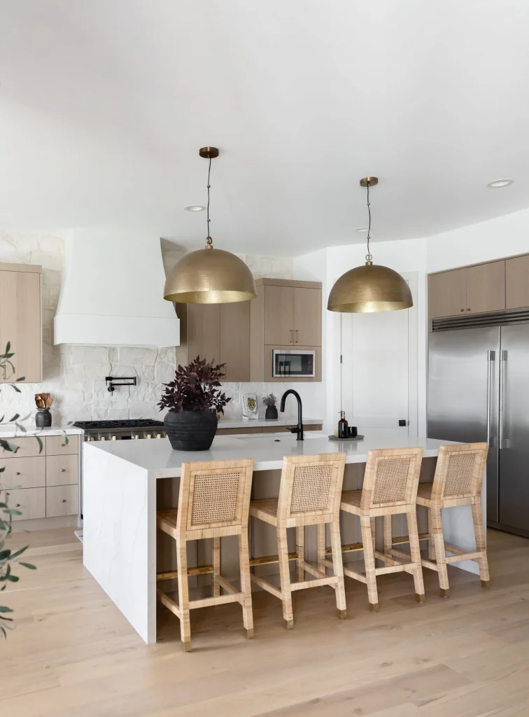 Modern kitchen with brass pendant lights