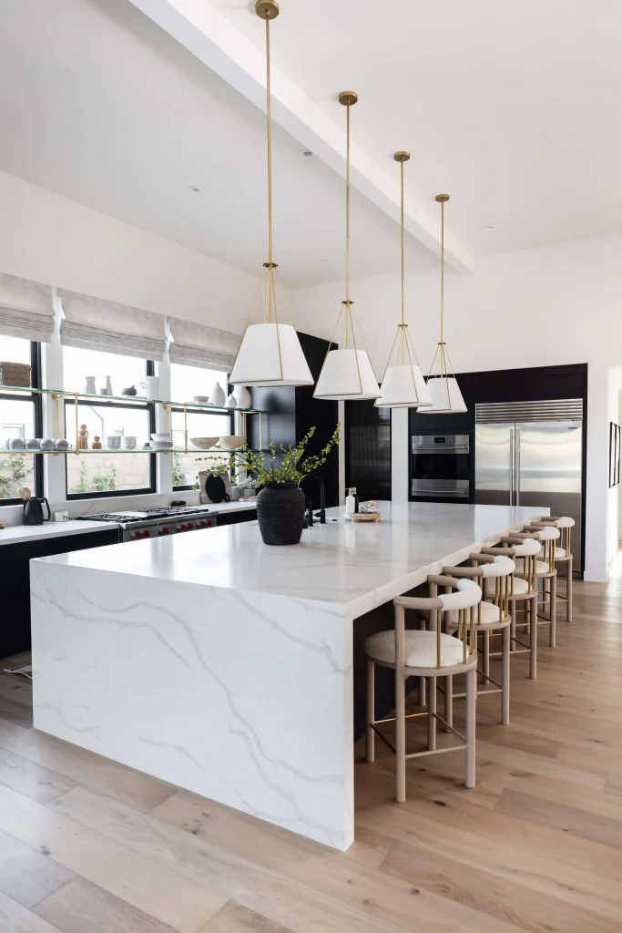 Kitchen with large white marble island