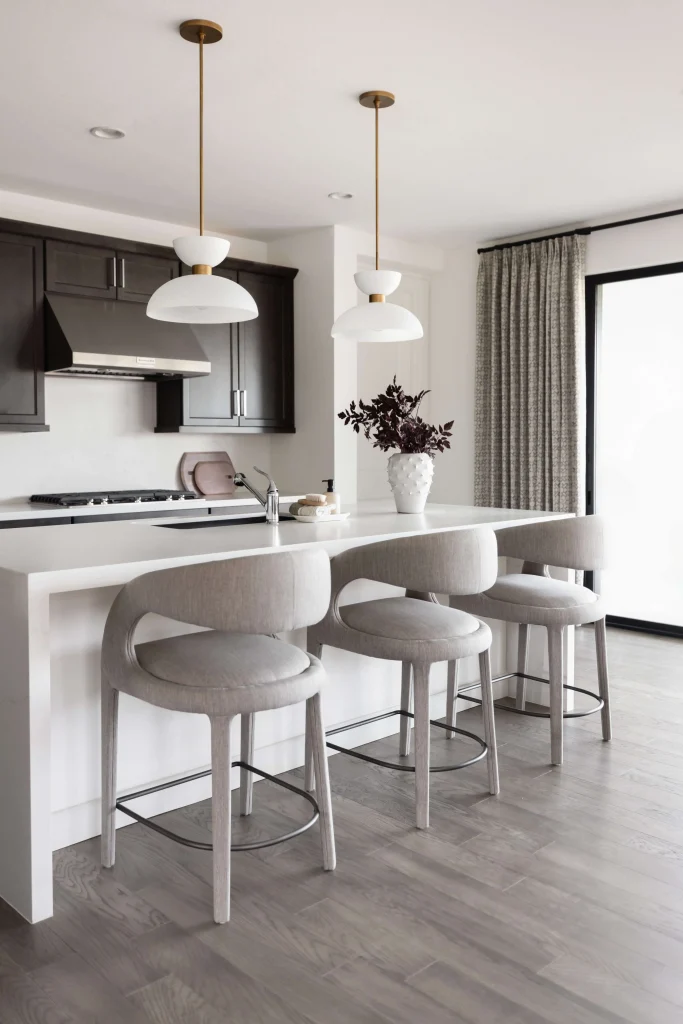 Modern kitchen island with gray stools