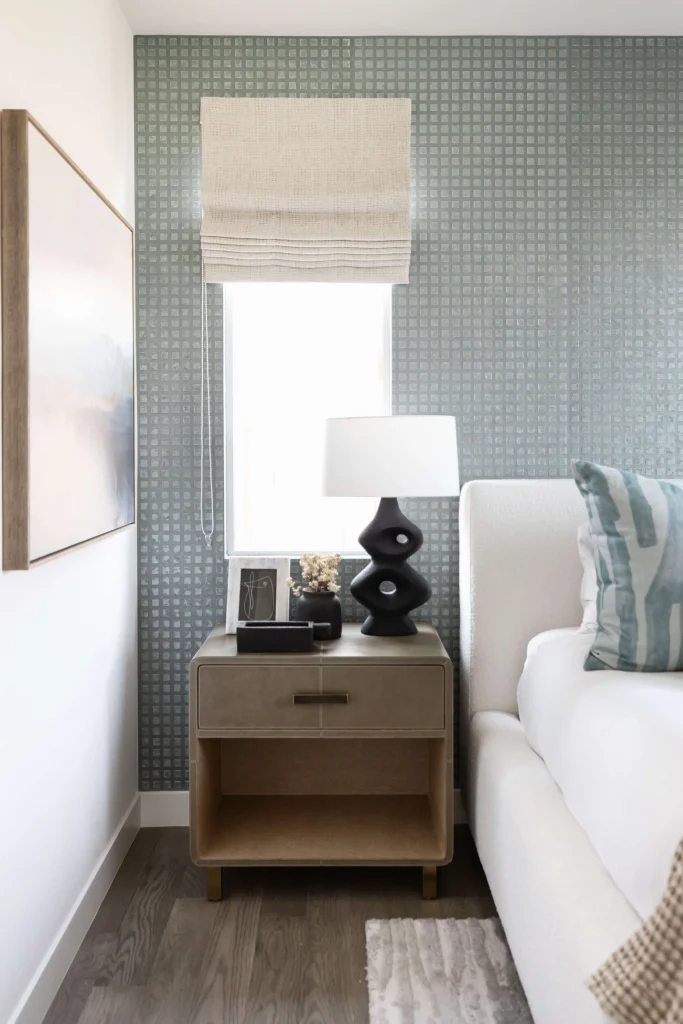 Modern bedside table with lamp and decor