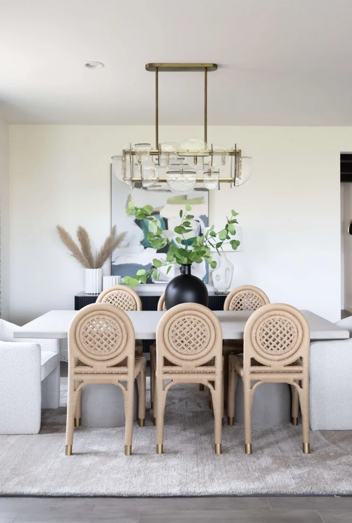 Elegant dining room with rattan chairs and chandelier