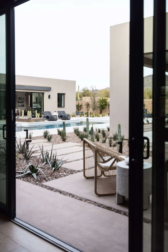 Modern patio with seating and pool view