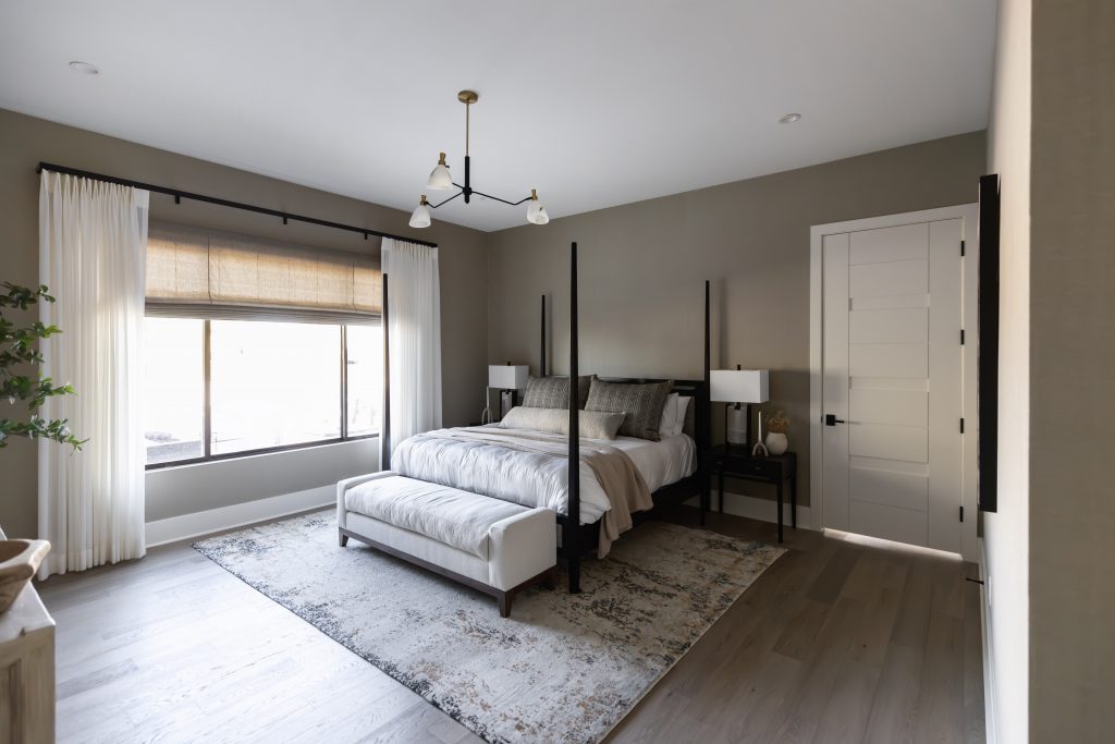 Neutral modern bedroom with four-poster bed