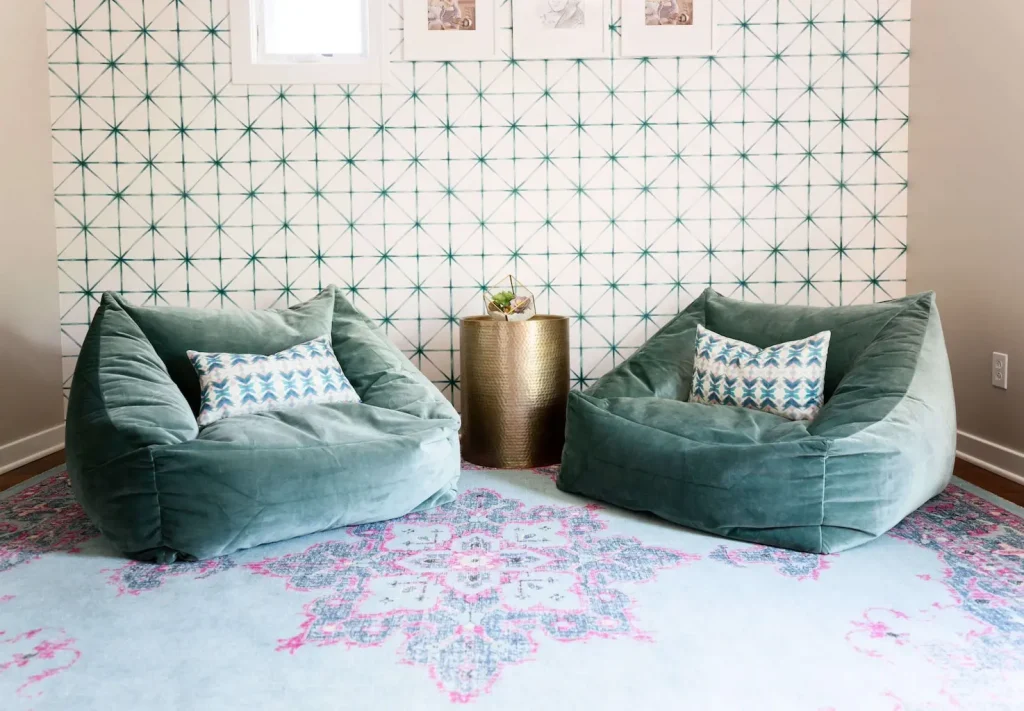 Lounge space with velvet chairs and gold side table