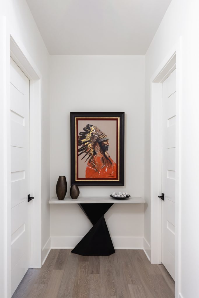 Minimalist hallway with artwork and table decor