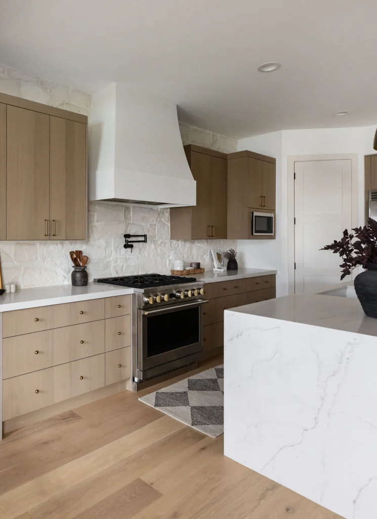 Modern kitchen with marble island and stove