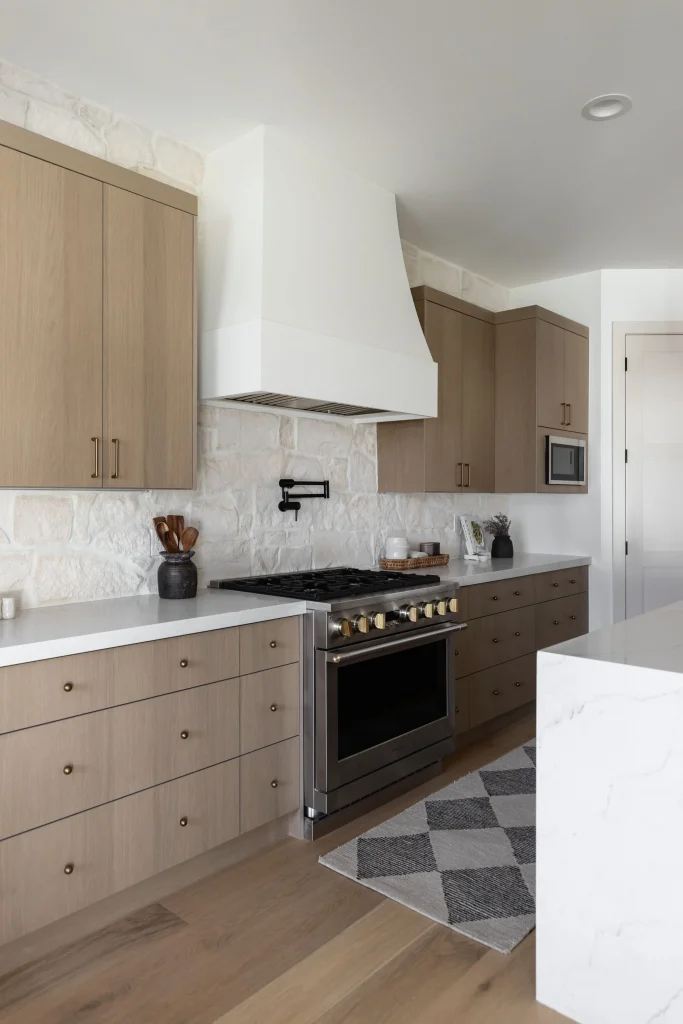 Kitchen stove area with stone backsplash