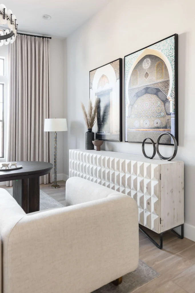 Textured sideboard with framed archway art