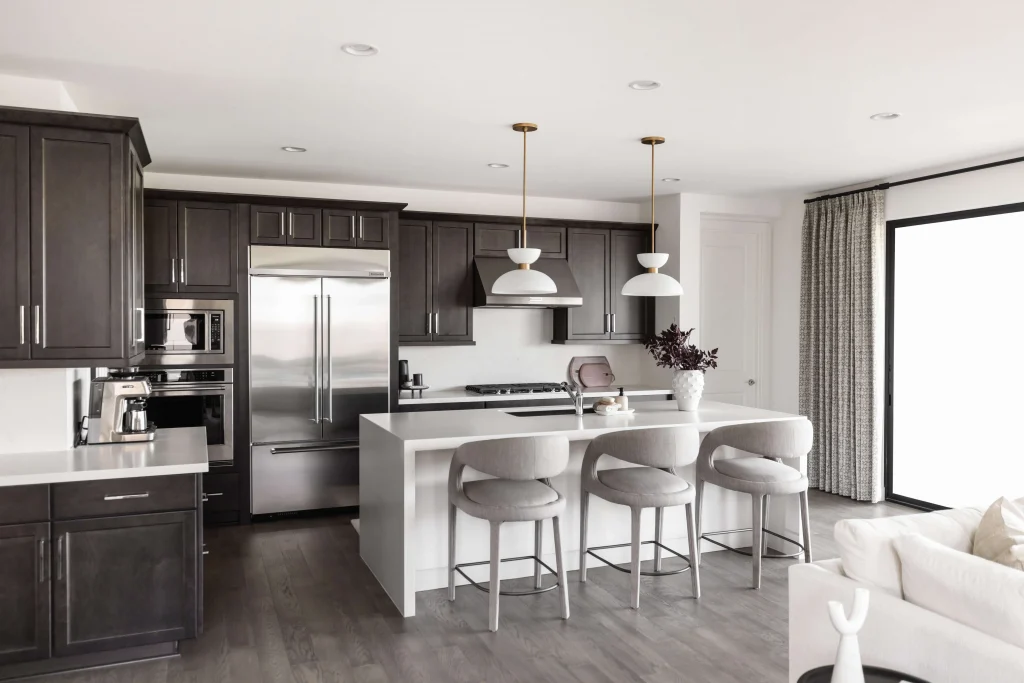 Kitchen with dark cabinets and island seating