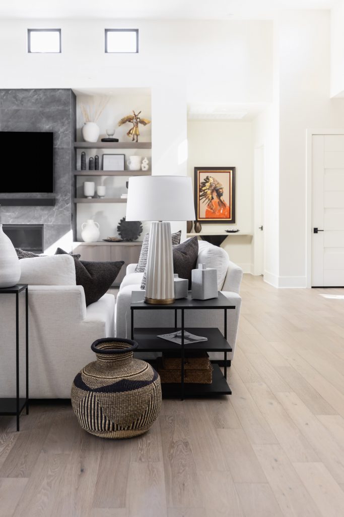 Bright living room with white sofas and decor