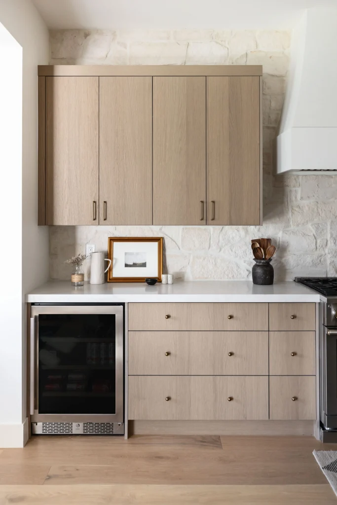 Kitchen cabinets with stone backsplash