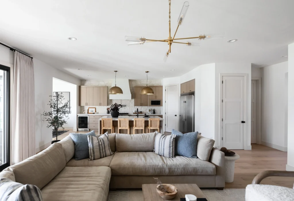 Open living room with beige sectional sofa
