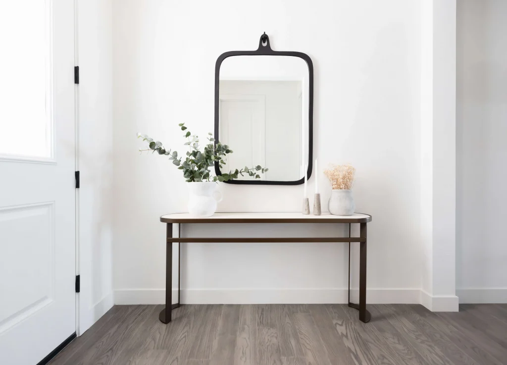 Minimalist entryway table with mirror and decor
