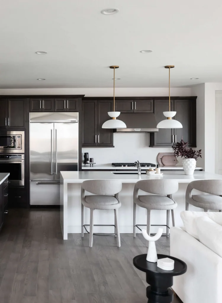 Modern kitchen with dark cabinets and white island