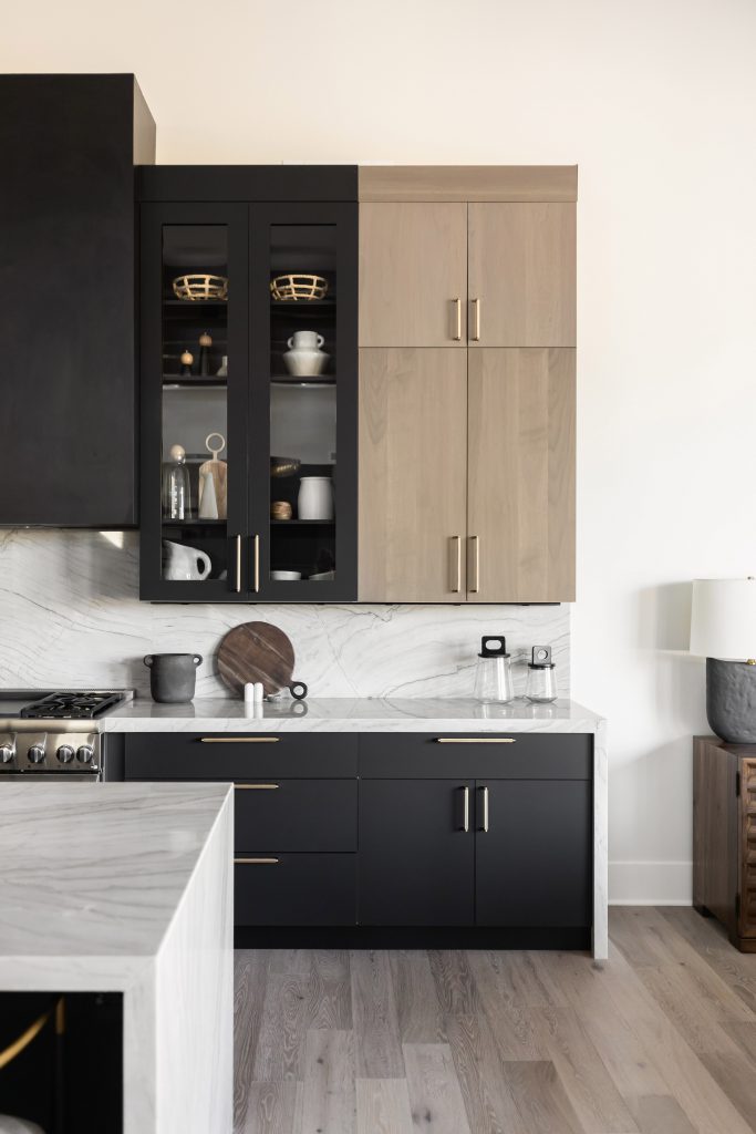 Kitchen with black and wood cabinets