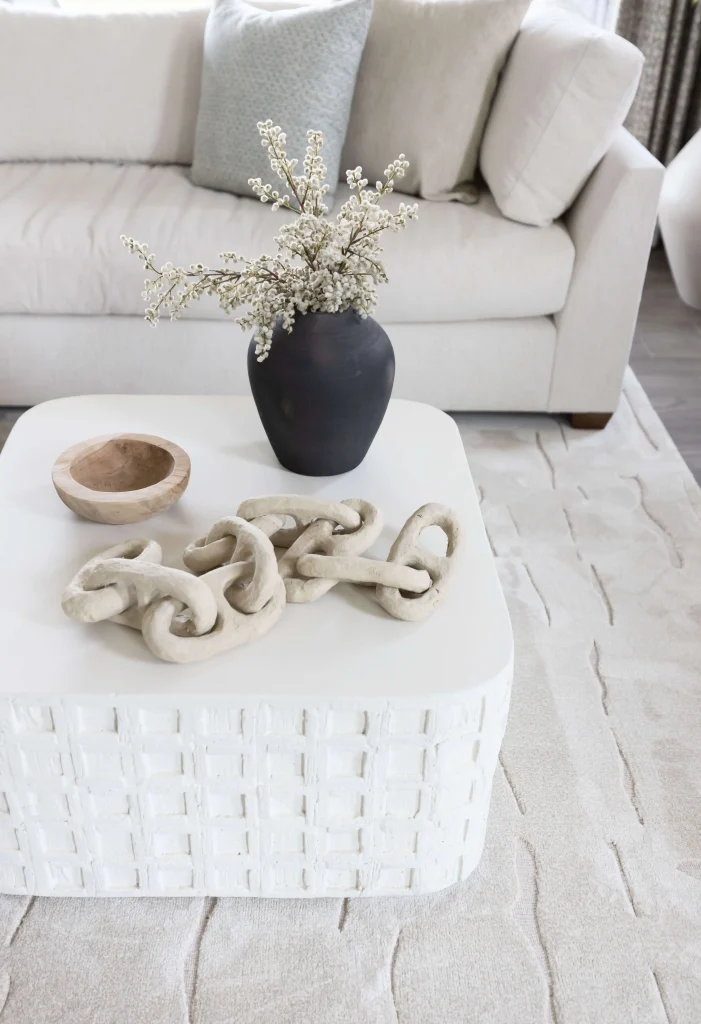 Modern white coffee table with decor accents
