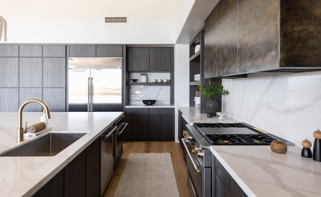 Dark wood kitchen with marble counters