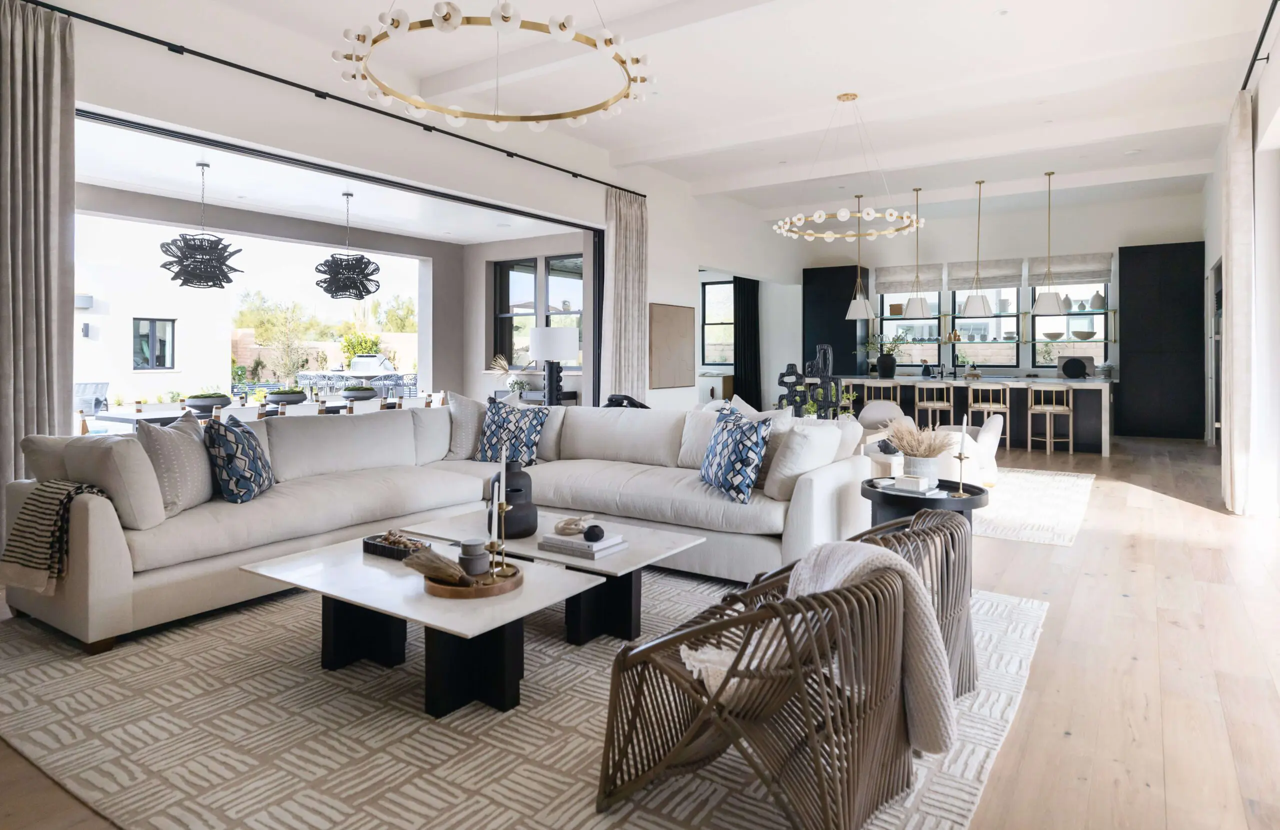 Bright living room with white sectional sofa and patterned cushions