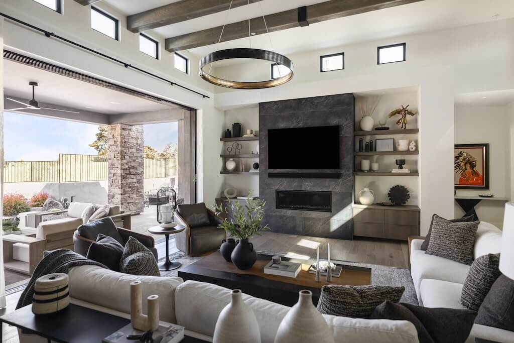 Modern living room with large windows and neutral furniture