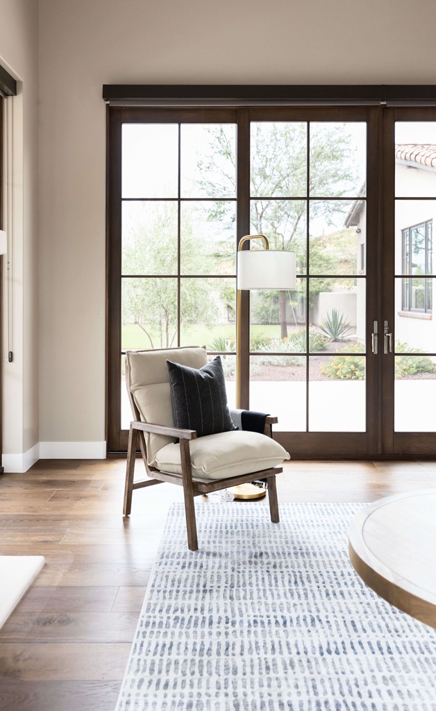 Cozy chair by large window with natural light