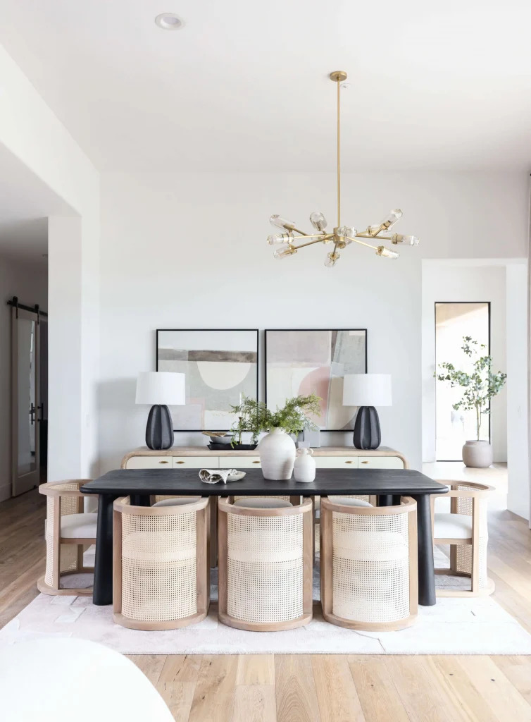 Bright dining room with black table