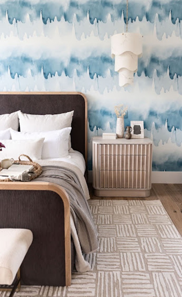 Modern bedroom with wave-patterned wallpaper and neutral decor