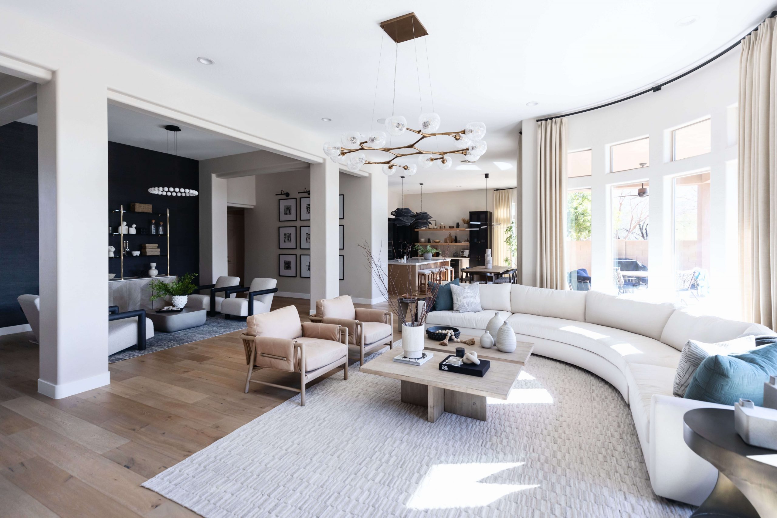 Neutral living room with white sofa and light wood accents